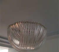 Chandelier cleaning with multiple layers of long curved glasses. Cleaned on site. West 86th. St. NYC.