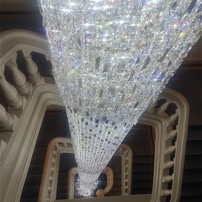 Cleaning of huge Cascade chandelier with Swarovski crystal by Vincent Van Duysen. 