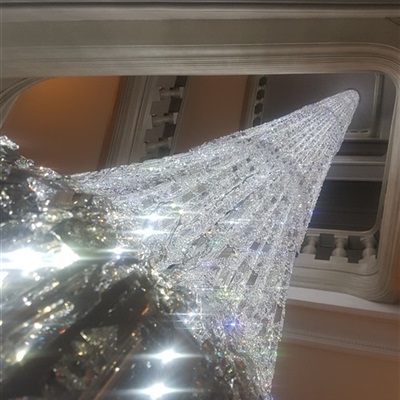 Located in Gramecy Park, New York, NY. Chandelier is 60' long, located inside a six story building stairwell. It has nearly 2900 crystal chains of 10' each. All cleaned by hand and one crystal at the time.
