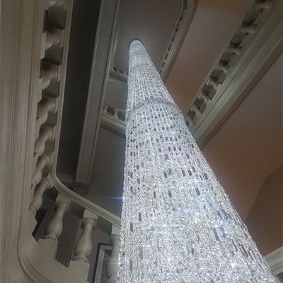 Located in Gramecy Park, New York, NY. The fixture is 60' long and its located on a six story building staiwell. It has nearly 2900 crystal chains of 10' each. 
All cleaned by hand and one crystal at the time. 